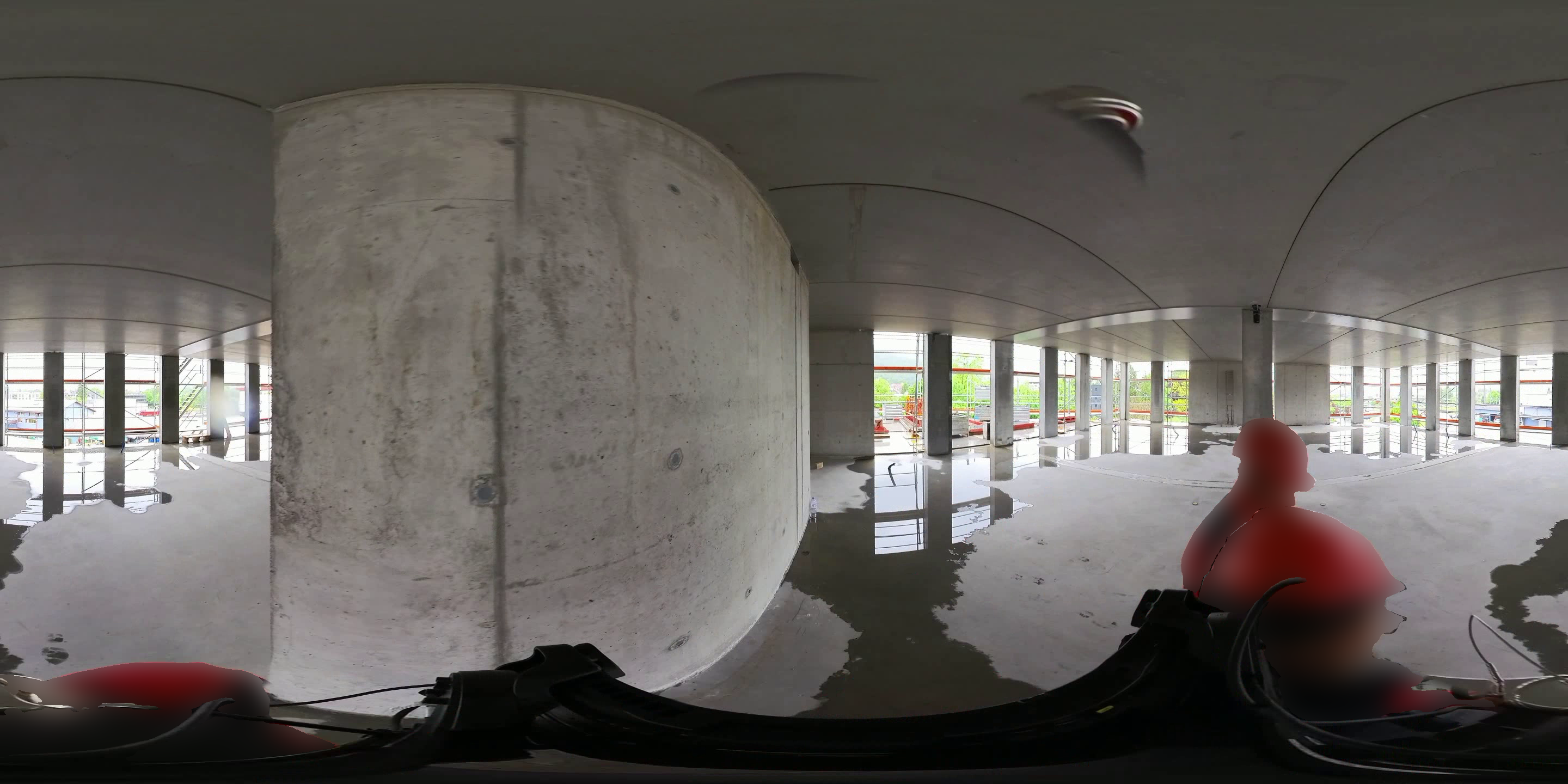 Equirectangular panorama of a construction interior with the projection seam falling in open space.